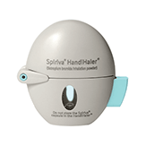 Oval-shaped Spiriva HandiHaler device for inhaling dry powder medication, featuring a gray body with a transparent window and a light blue button on the side.