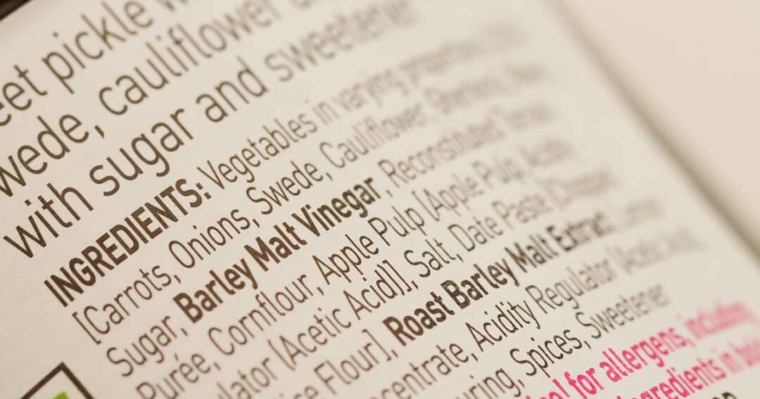 Closeup photo of a food ingredient label, showing potential allergens in bold.