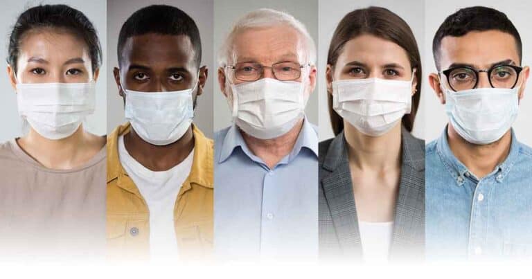Five people wearing white face masks are lined up. They vary in age and gender, and their clothing includes casual and formal styles. The background is neutral, emphasizing their masked expressions.