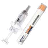 A medical syringe and a tube of topical adhesive gel are placed side by side on a white background. The syringe is transparent with a clear body, while the tube has an orange cap and visible branding and text.
