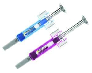 Two metallic pens shaped like syringes, one in blue and the other in purple, are displayed on a white background.